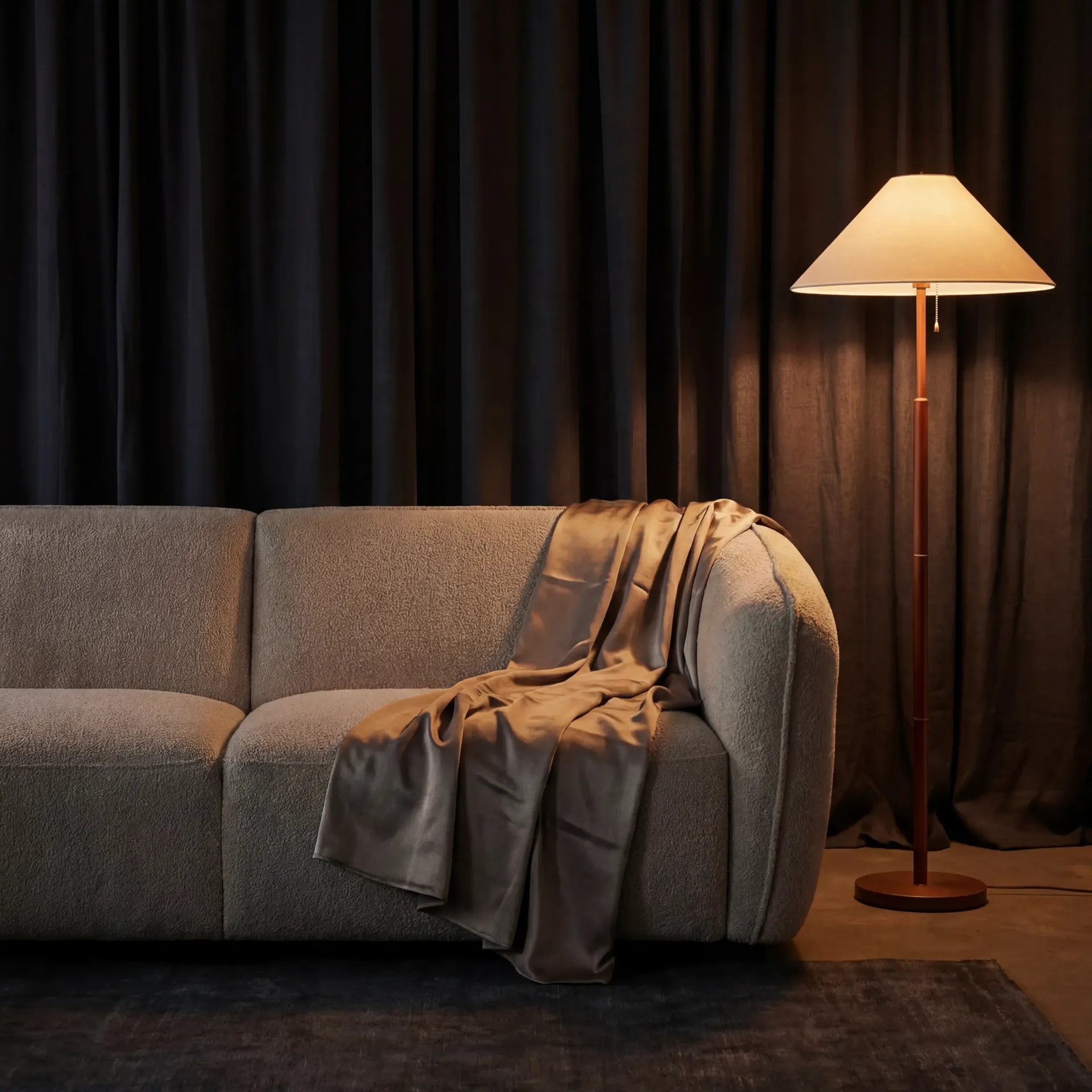 Loures Open-End Sectional — moody evening scene with floor lamp and throw blanket