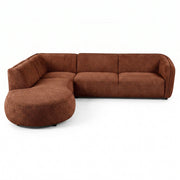 A modern curved sectional sofa upholstered in a textured brown fabric, featuring a three-seat section, a right-side armrest, and a large round ottoman-style chaise, shown on a plain white background.