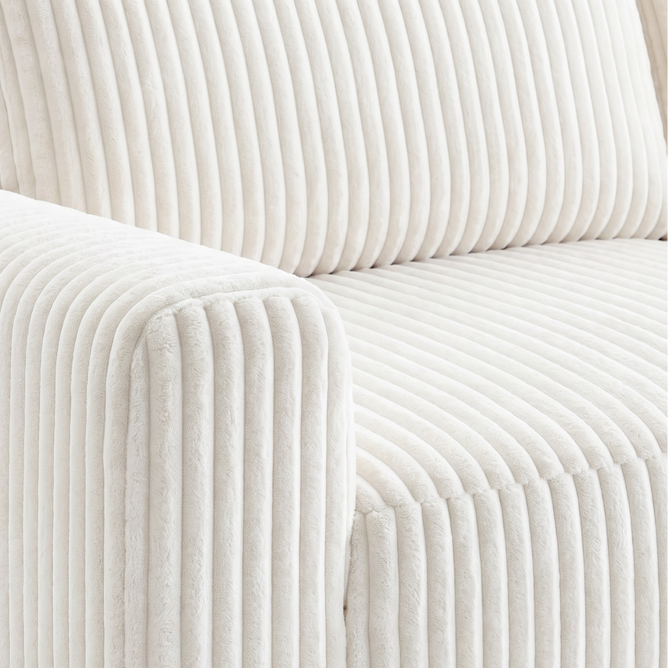Close-up of a white ribbed sofa on a light gray background