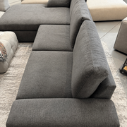 Gray sectional sofa in a living room setting