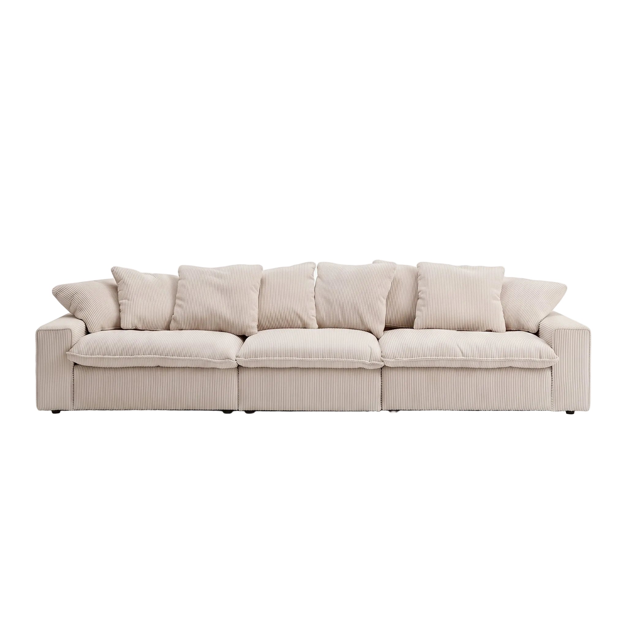 A modern three-seater sofa upholstered in a light beige ribbed fabric, featuring multiple square back cushions and matching throw pillows, set against a seamless white studio background.